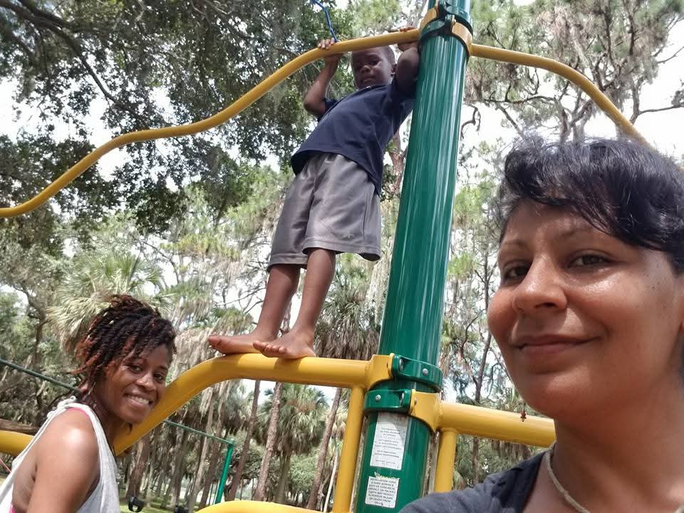 Melania and King Solomon playing together outdoors